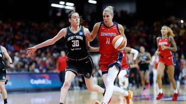 Washington Mystics forward Elena Delle Donne dribbles past New York Liberty forward Breanna Stewart.